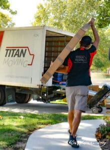 Titan Moving professional carefully handling a fragile art box in Wichita.