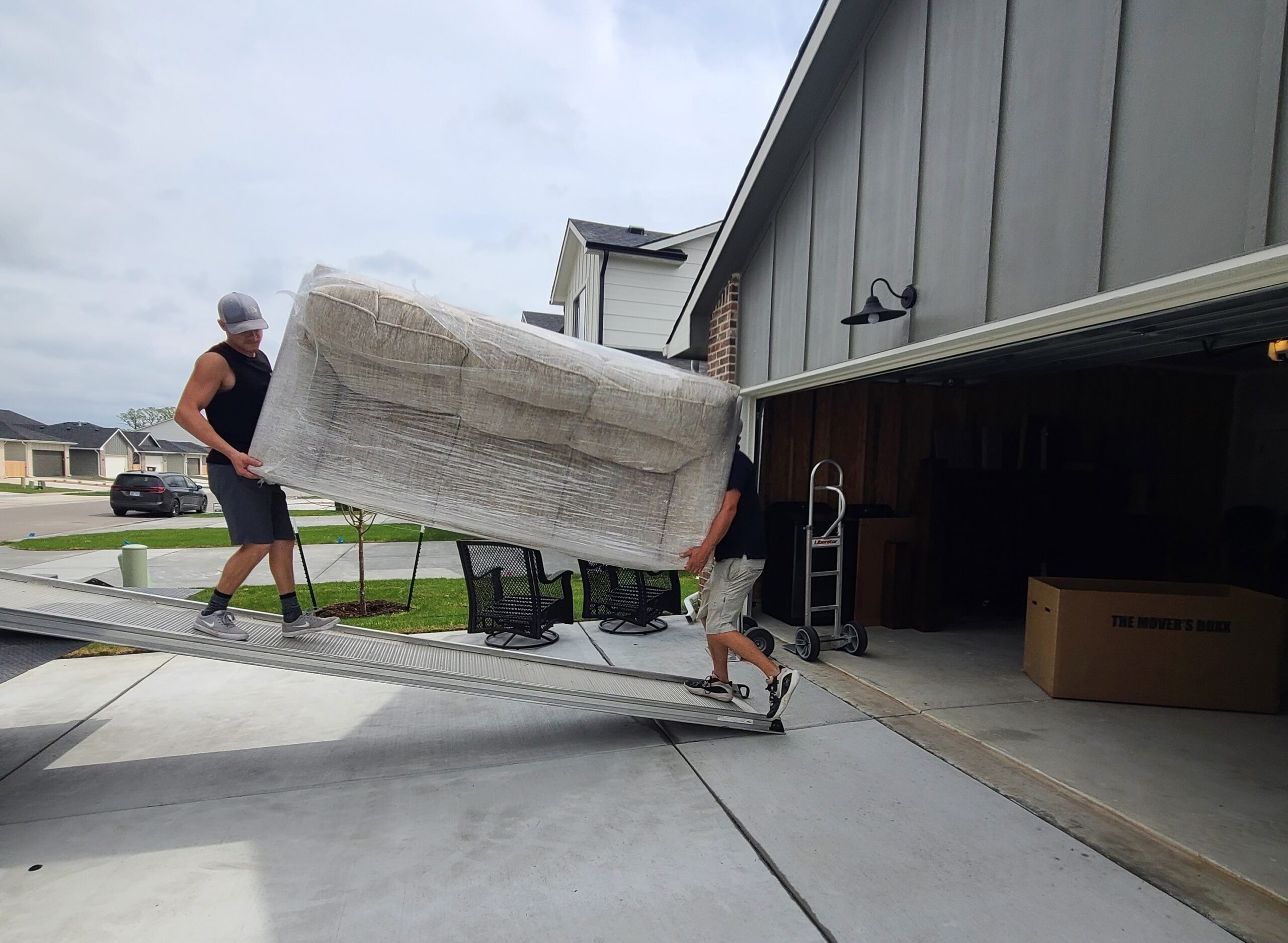 Titan Moving crew and truck providing residential moving services in Derby, Kansas.